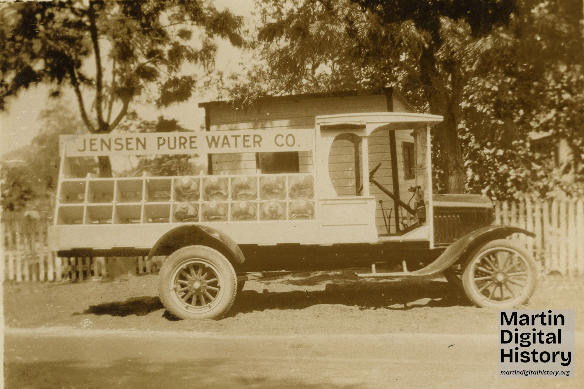 Water truck from 1926 with Jensen Pure Water Co written on the side