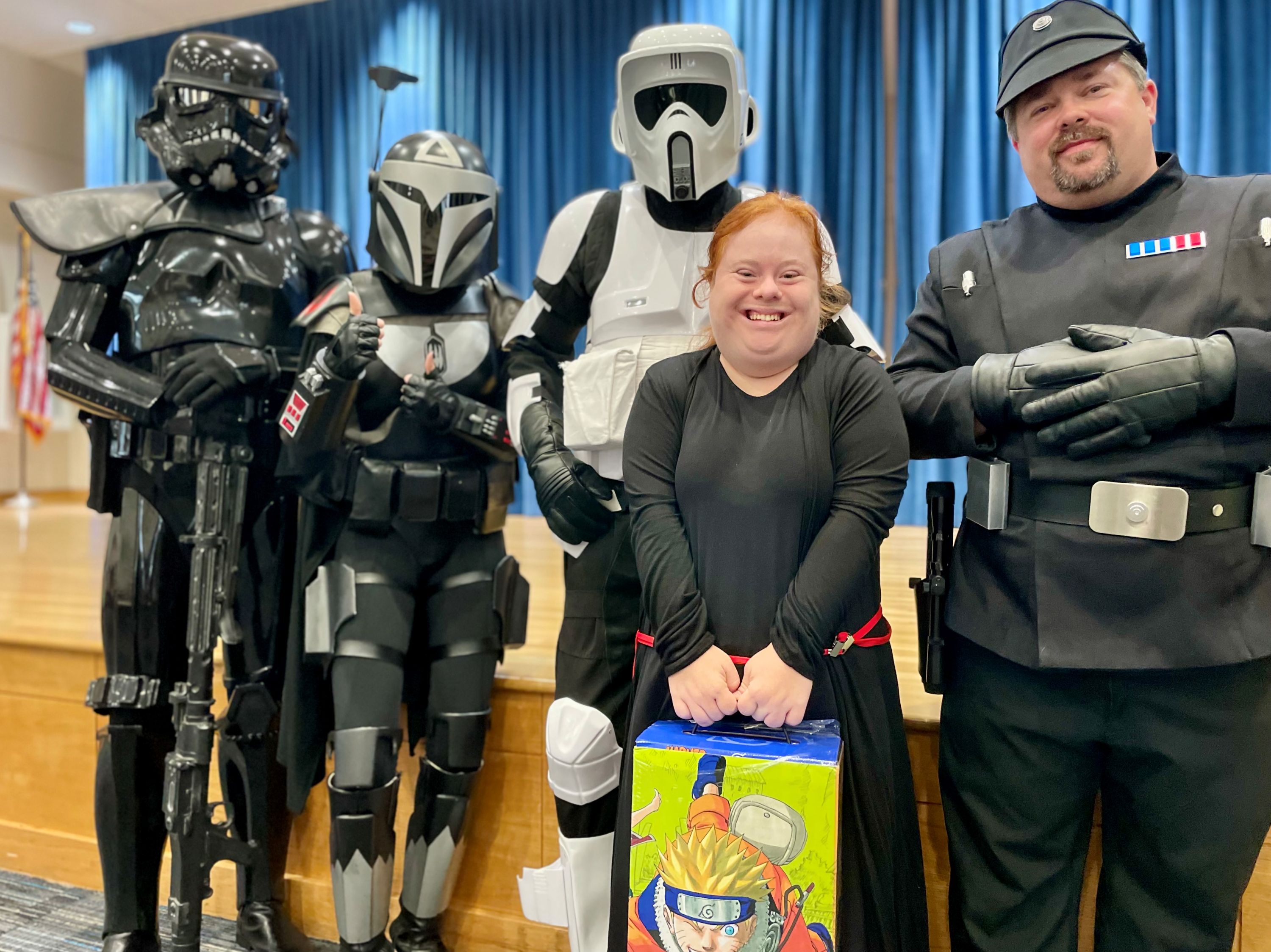 501st Storm Troopers with winner of raffle smiling